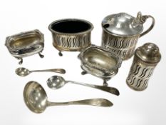 Two silver caddy spoons, together with a further EPNS spoon, a cruet set, and a pair of salts.