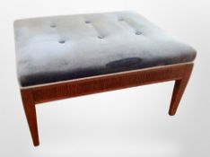 An early 20th-century mahogany-framed rectangular foot stool in blue dralon upholstery, length 80cm.