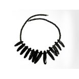 A black coral necklace, length 48 cm.