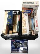 Two crates containing board games, dominoes, cribbage board,