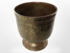 An Indian engraved and enameled brass pot,