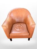 A mid 20th-century Danish armchair upholstered in tan stitched leather.
