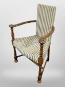 An early 20th-century Danish beech-framed corner armchair.