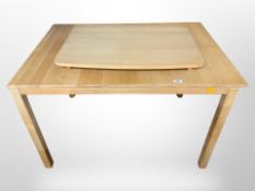 A 20th-century Danish blonde oak drop-leaf extending dining table, 112cm x 75cm x 73cm (unextended).