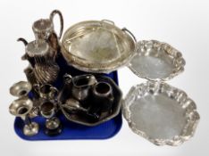 A collection of silver-plated wares including tea service, trophies, swing-handled bowl,