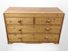 A late Victorian pine four-drawer chest, 117cm x 49cm x 72cm.