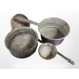 A 19th-century copper cast iron-handled cooking pan, further ladle, a pewter bowl, and a brass bowl.