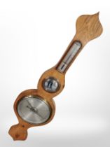 A banjo barometer with silvered dial, height 95cm.