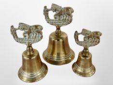 Three graduated brass bells, height 12cm.