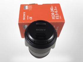 A Sony Alpha FE 24-240mm F3.5-6.3 OSS lens in box.