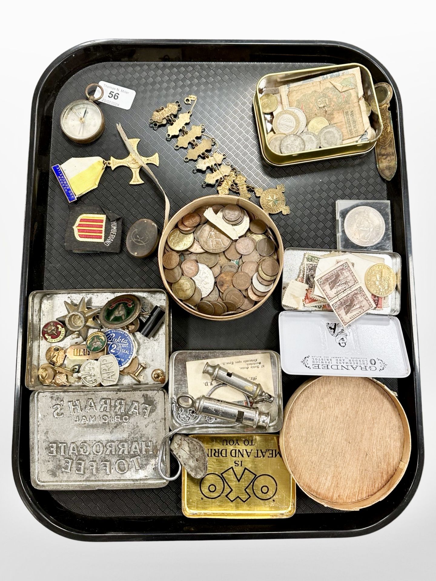 A collection of coins, badges, antique compass, bookmark, A R P and Acme whistles, etc.