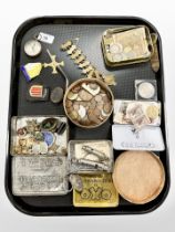 A collection of coins, badges, antique compass, bookmark, A R P and Acme whistles, etc.