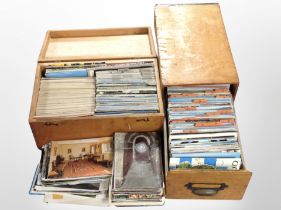 Two pine boxes containing a large quantity of vintage post cards.