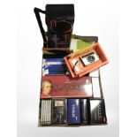 A box of classical CD box sets, camera, radio, etc.