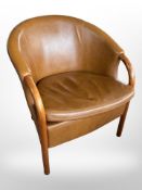 A 20th century Danish tan leather armchair