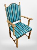 A Danish blonde oak armchair in striped turquoise upholstery, width 59cm.