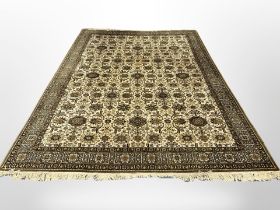 A machine made carpet of Afghan design,