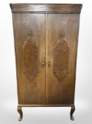 An oak and burr walnut double-door wardrobe, 88cm x 38cm x 163cm.