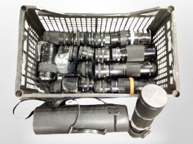 A group of camera lenses including Soligor, Chinon, Pentax, etc.