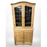 A Danish blonde oak glazed double-door cabinet, 87cm x 48cm x 175cm.