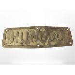 A brass Huwood plaque, length 37cm.