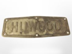 A brass Huwood plaque, length 37cm.