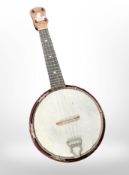 A four-string banjo ukelele.