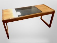 A 1970s teak and smoked glass rectangular coffee table, 95cm x 43cm x 43cm.