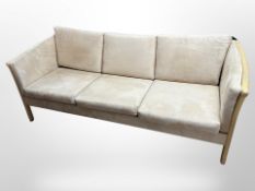 A contemporary Danish beech-framed three-seater settee upholstered in suede fabric,