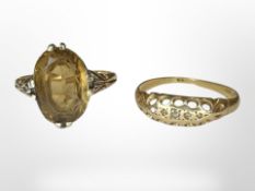 An 18ct gold citrine ring and a further ring, marks rubbed.