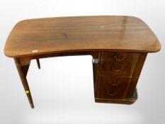 An early 20th-century Danish walnut inverted bow-front single pedestal writing desk,