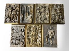 A group of seven cast metal Anders Nyborg rectangular wall plaques, each 25cm x 16cm.