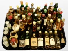 A large quantity of alcohol miniatures including Glayva, Teacher's whiskey, Glenfiddich,