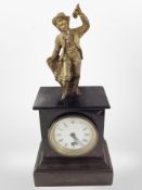 A Victorian black slate figural mantel clock, height 35cm.