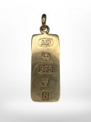 A large 9ct gold ingot pendant, total length 49mm. CONDITION REPORT: 9.