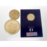 A gold-plated commemorative coin, 'The Year of the Three Kings, 1936', and two other coins.