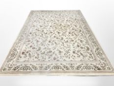 A machine-made carpet of Persian design, 340cm x 240cm.