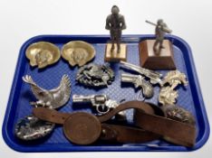 A group of diecast metal guns, brass portrait plaques, figure of a soldier and a knight on plinth,