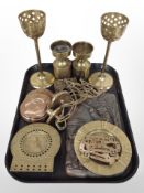 A group of metal wares including a plaque depicting a man shooting with a gun dog, jelly moulds,
