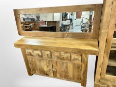 A contemporary mango wood sideboard fitted with drawers,