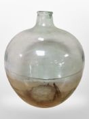 A large glass carboy, height 50cm.