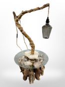 A contemporary driftwood glass topped occasional table,