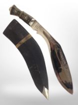 A kukri knife in sheath.