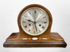An Edwardian inlaid mahogany eight day mantel clock with silvered dial,