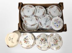 A box of assorted porcelain cake stands.