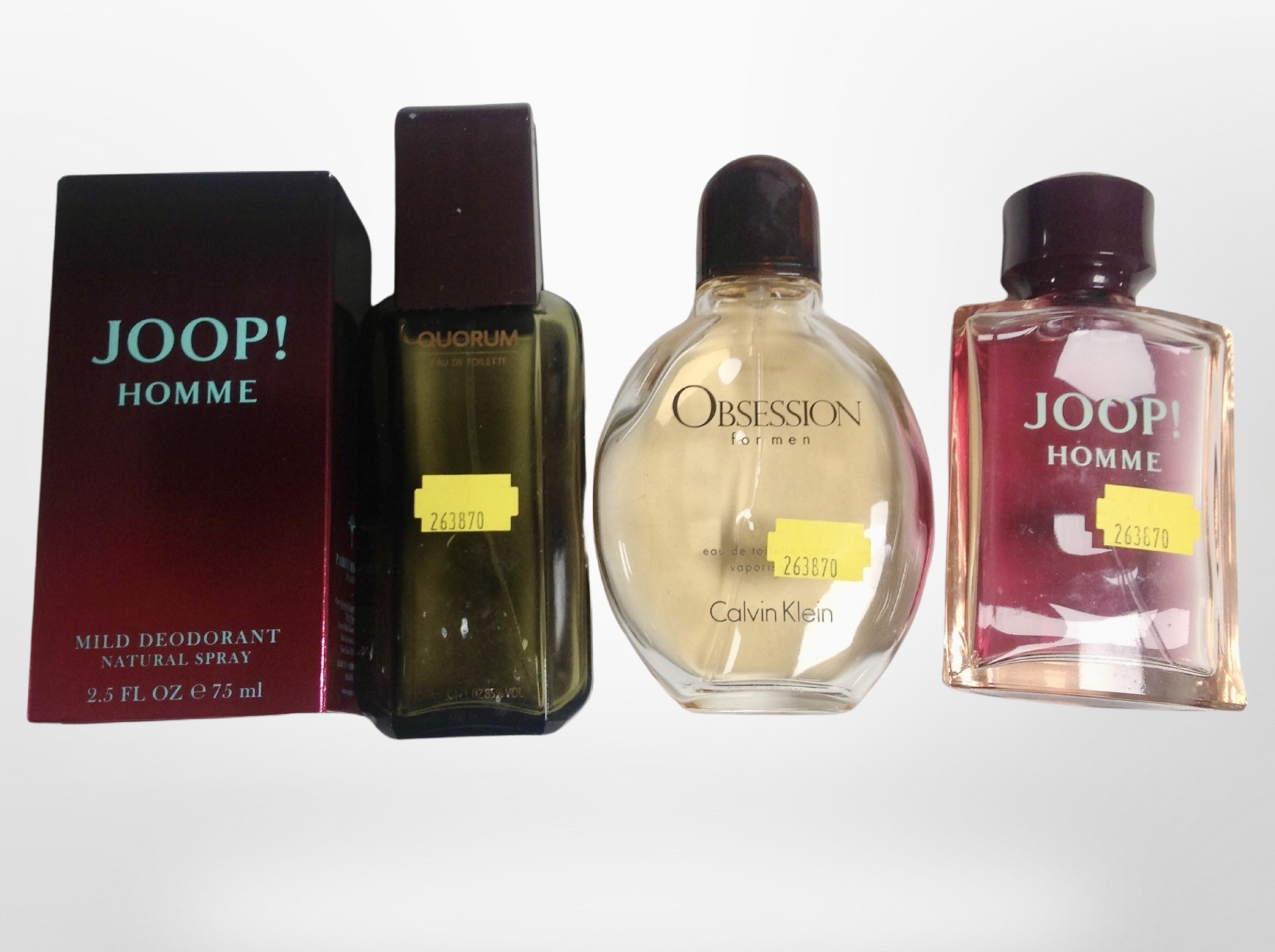 A bottle of Joop Homme natural spray, 75ml, in box, and three further fragrances (opened).