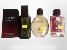 A bottle of Joop Homme natural spray, 75ml, in box, and three further fragrances (opened).