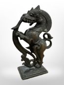 A 19th century Indo-Tibetan bronze figure of a dragon, height 12cm.