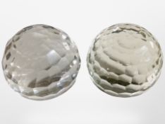 A large pair of faceted crystal spherical paperweights, each 11cm.