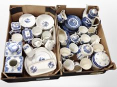 Two boxes of assorted blue and white ceramics including willow pattern items, Ringtons caddies,